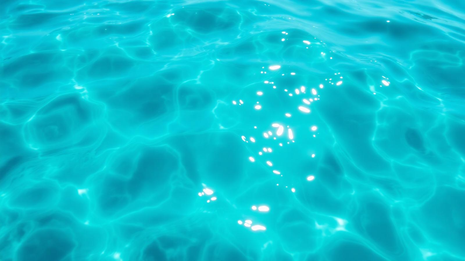 Sunlit clear turquoise water with soft caustic light patterns